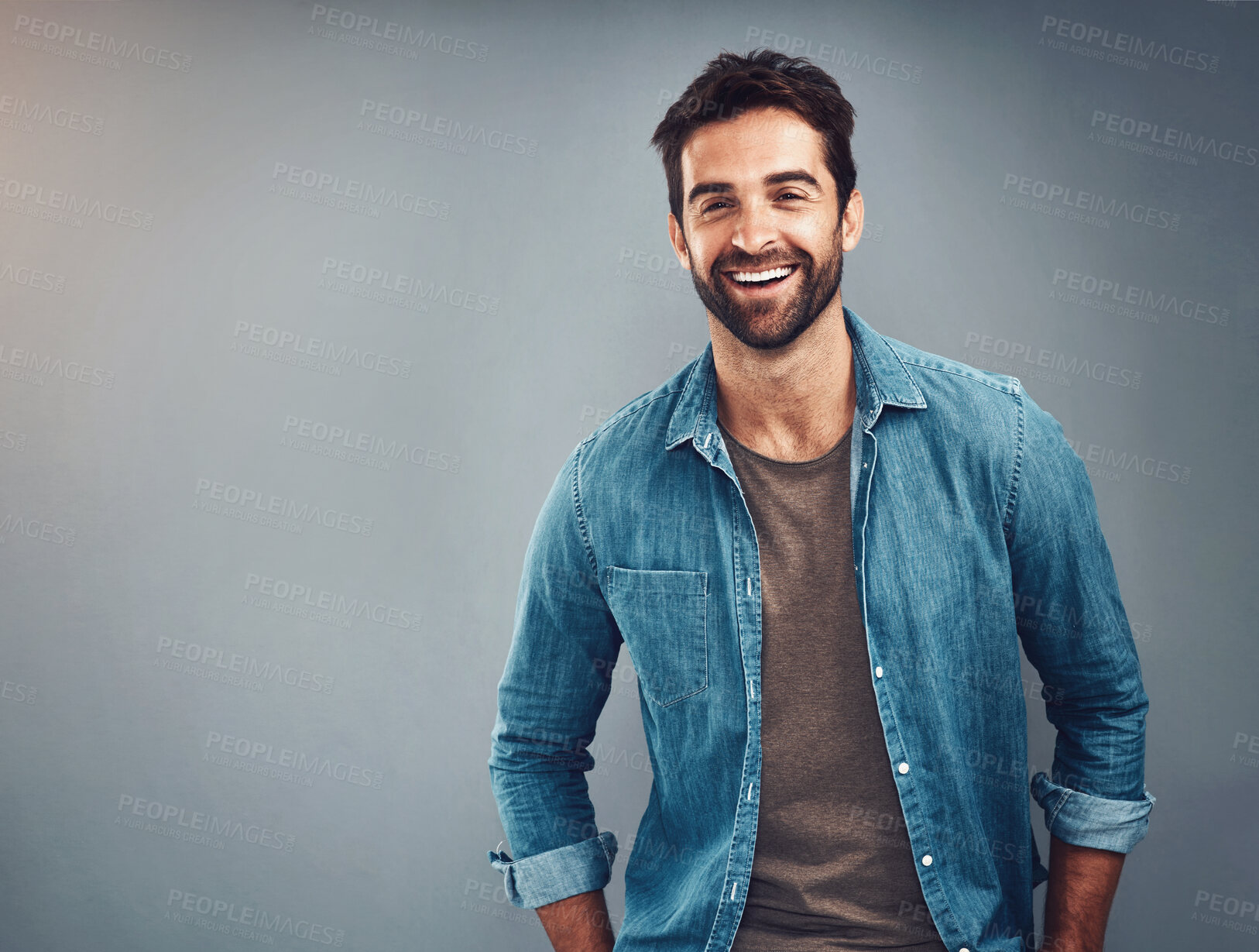 Buy stock photo Fashion, mockup and smile with portrait of man in studio on gray background for relaxed clothing style. Casual, happy and space with natural person in clothes outfit to model jacket or wardrobe