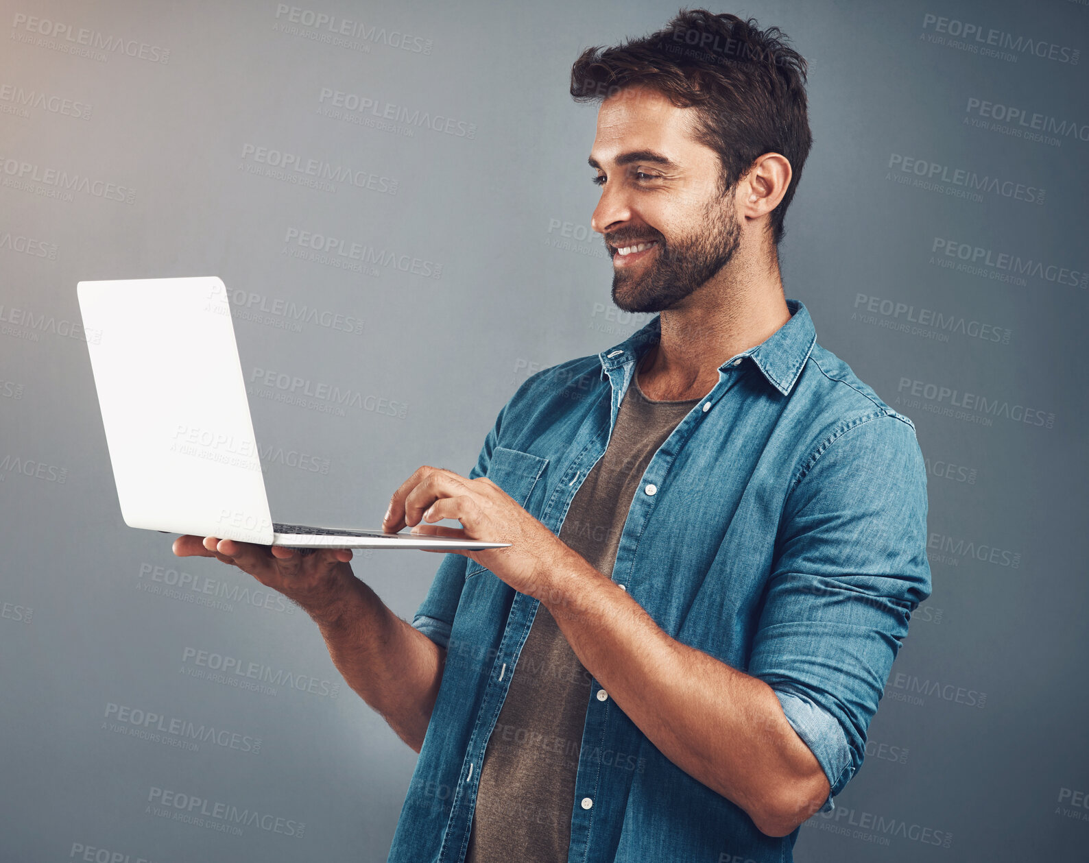 Buy stock photo Happy, businessman and laptop for video call or virtual meeting with connection isolated in studio. Smile, male perosn or employee and computer for networking and online seminar with gray background