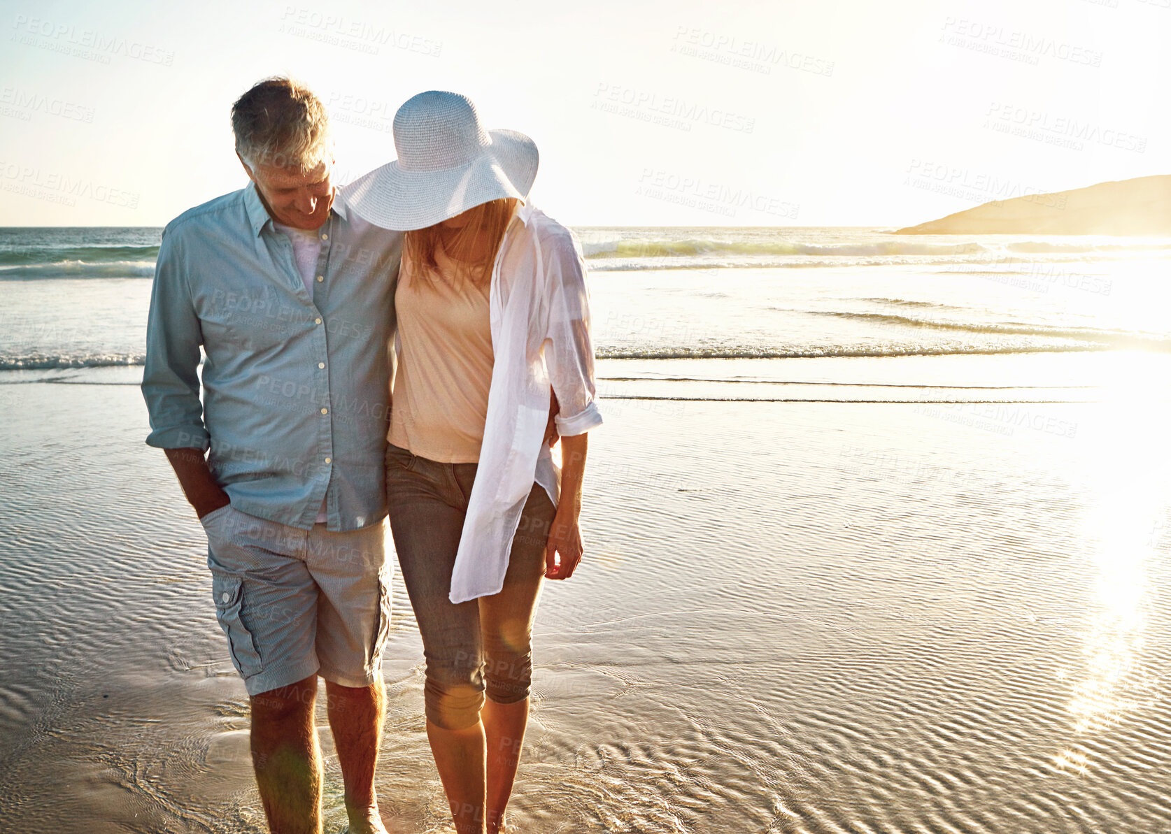 Buy stock photo Happy couple, walking and beach for holiday on island or coast for getaway, travel and vacation in Bali. Woman, man and relationship for love or marriage anniversary by ocean at sunset in Indonesia