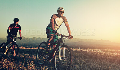 Buy stock photo Sunset, men and friends in bicycle race with helmet, exercise and adventure trail in nature together. Cycling, fitness and people with mountain bike in evening for outdoor workout, energy and smile