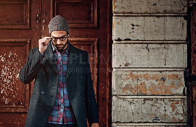 Buy stock photo Man, downtown fashion and city by building wall with creative job, style and entrepreneur with glasses. Thinking, idea and road with trendy, cool and hip clothes in New York outdoor with urban beanie