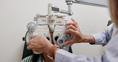 Eye care, medical and child in clinic, test and hand of specialist, phoropter or refractor for girl. Healthcare, technology and machine for help for kid, exam and vision for check up in hospital