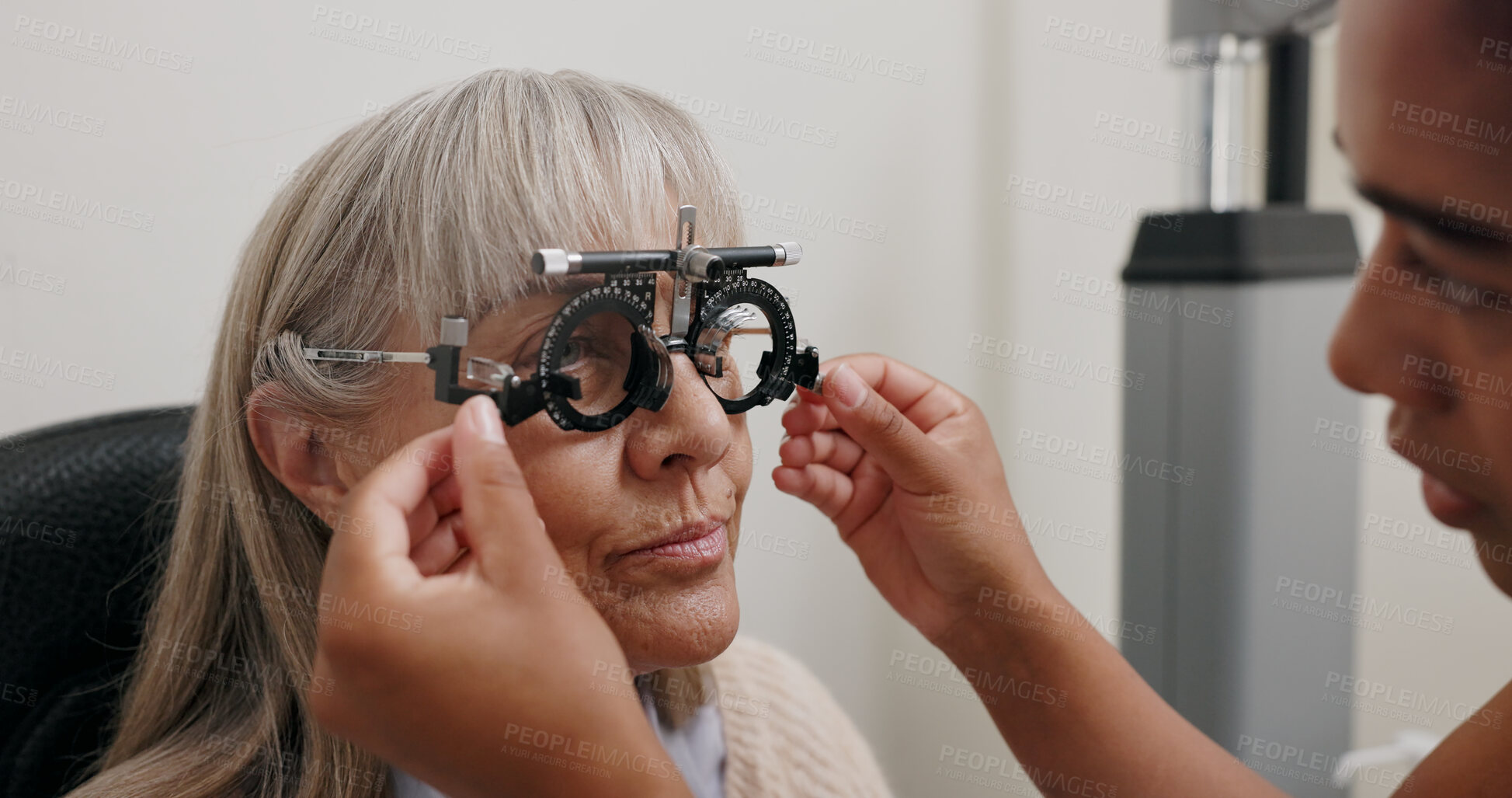 Buy stock photo Women, doctor and patient with trial lens for eye exam, vision test and prescription for glasses at store. Optometrist, consultation and equipment with assessment for eyesight, care and support