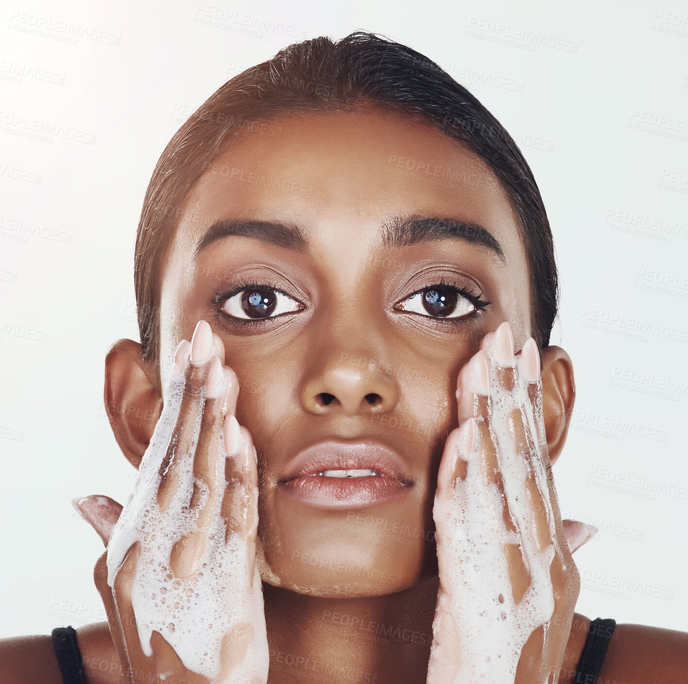 Buy stock photo Portrait, soap and woman cleaning face for skincare, hygiene or health in studio isolated on a white background. Facial, foam and Indian person washing for beauty, cosmetics and dermatology treatment