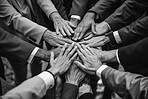 Business, people and hands together in meeting, stack and teamwork for support, trust and motivation for growth on company. Group, partnership and ideas, planning and brainstorming for negotiation