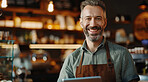 Portrait, man or waiter with apron in coffee shop for customer service, employment or small business. Happy, male person or barista in cafe or restaurant with smile for hospitality and confidence