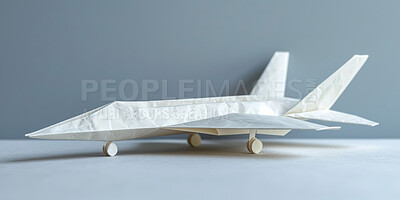 Paper plane, toys and art in studio by background for flight, global transport and recycle waste for creativity. Airplane, commercial or private jet with creativity, origami or international services