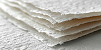 Material, texture and stack of handmade paper for eco friendly, sustainability and printing. Fabric, creative and renewable resource with sheet in pile for biodegradable, environment and conservation