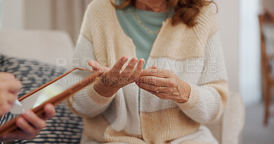 Hands, arthritis and senior woman consulting with nurse for medical advice on joint pain, treatment options and healthcare. Tablet, writing and notes for information or assessment and examination.