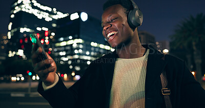 Black man, headphones and music with city, night and audio livestream or subscription. African guy, podcast or radio for streaming, listening and urban track with technology and dance for techno