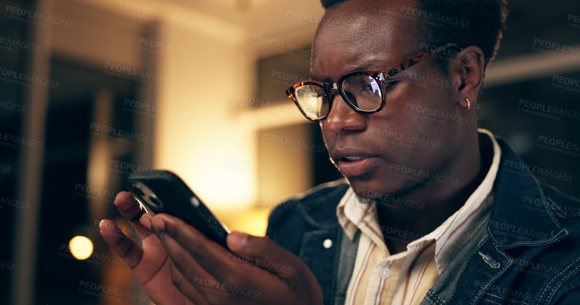 Buy stock photo Bad news, face and phone with business black man closeup  in office at night for deadline or overtime. Grief, sad or stress with unhappy employee at workplace in evening for mobile communication