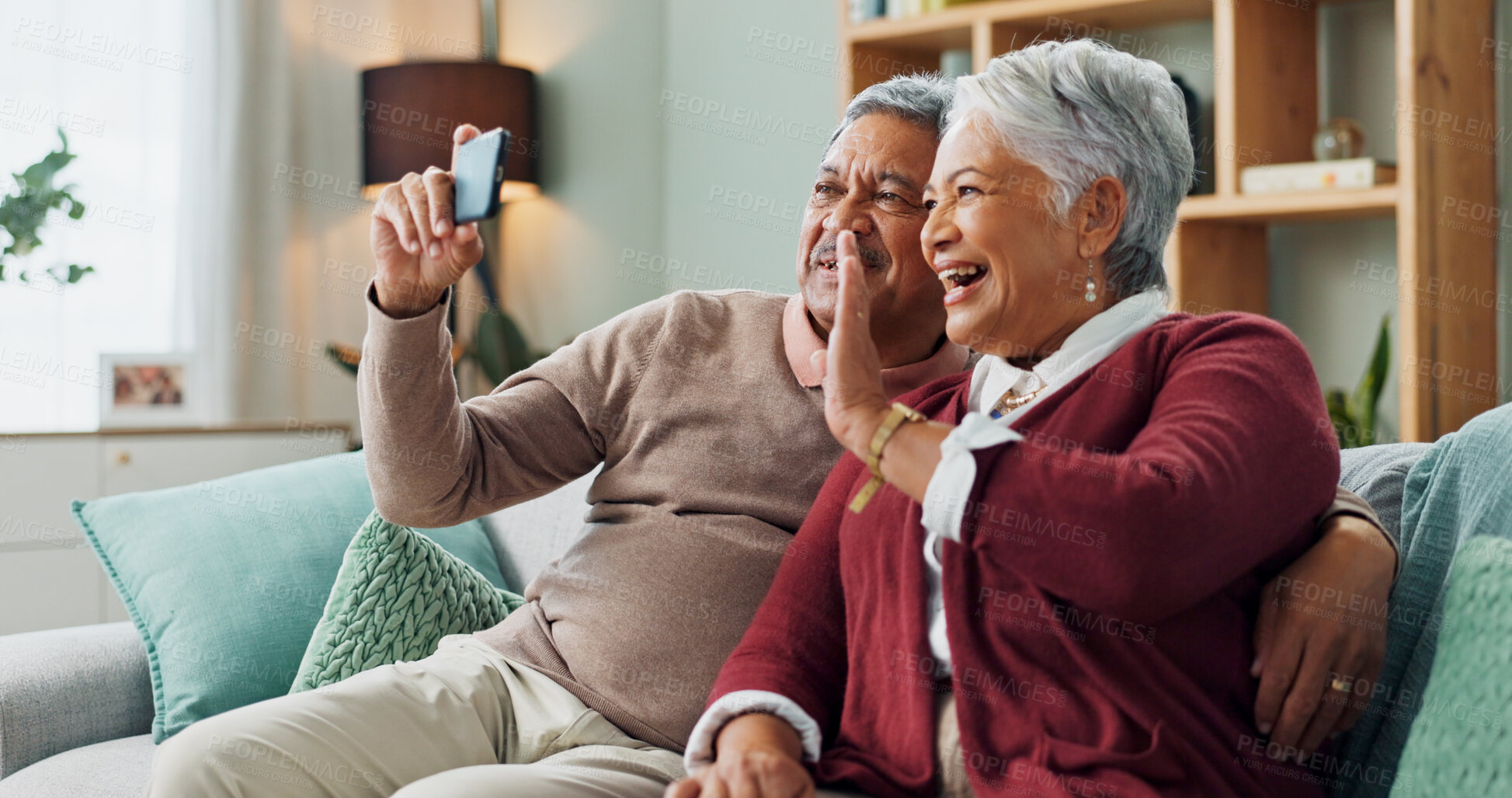 Buy stock photo Senior couple, laugh and smartphone for video call, contact and communication in living room. People, mature man and woman on sofa, couch and house together with cellphone for online conversation