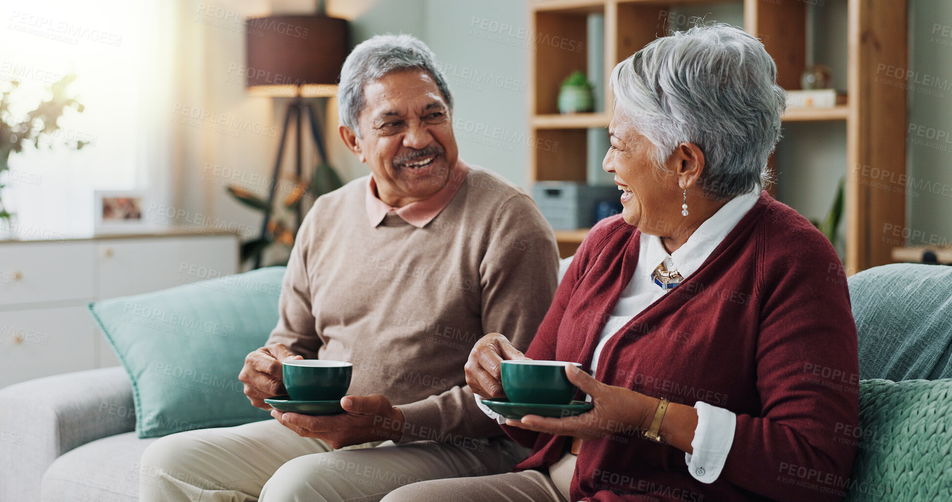 Buy stock photo Living room, relax and elderly couple with coffee for love, bonding and funny conversation. Senior people, smile and happy with drink for morning discussion, communication and peace in retirement