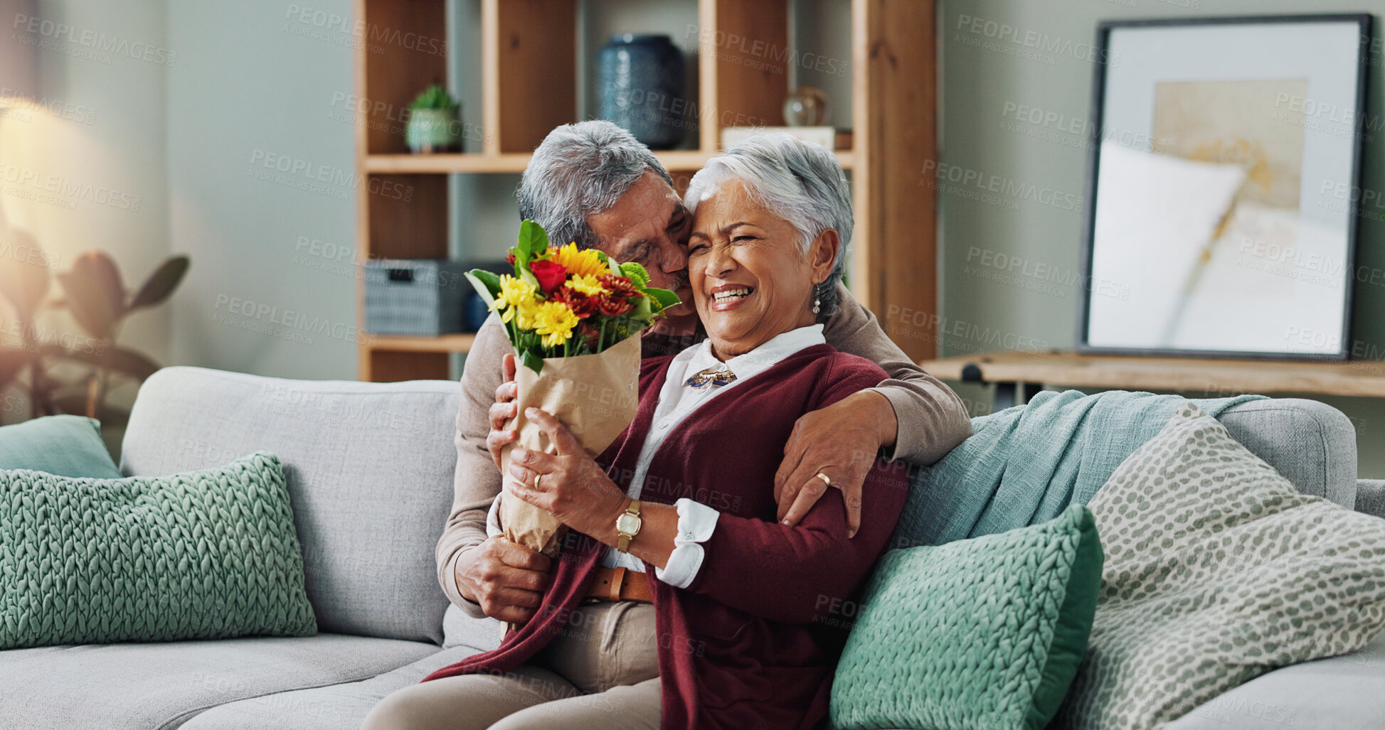 Buy stock photo Couple, woman and old man with gift of flowers on sofa or couch, happy and living room of house. Senior, male person and partner with surprise for love, smile and happiness in home and retirement