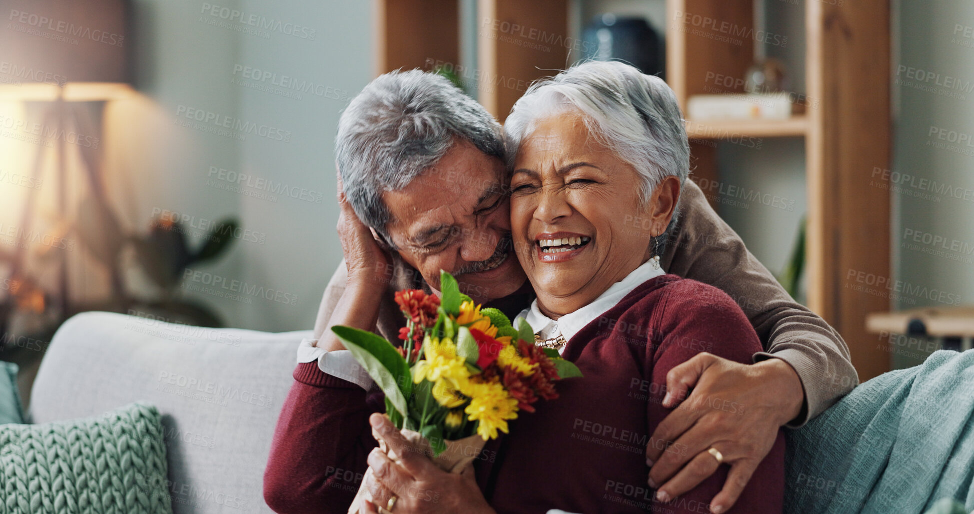 Buy stock photo Couple, woman and old man with gift of flowers on sofa or couch, happy and living room of house. Senior, male person and partner with surprise for love, smile and happiness in home and retirement