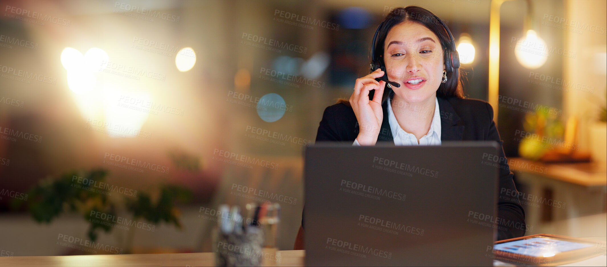 Buy stock photo Call center, laptop and woman at night in office for customer service, CRM advisory and sales questions. Happy virtual assistant talking on computer in telecom support, communication or telemarketing