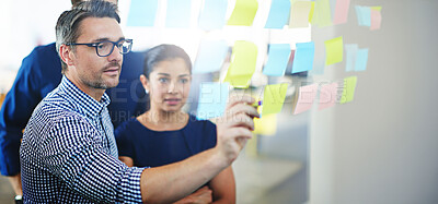 Buy stock photo Businessman, glass wall and collaboration for writing goals and planning strategy for seo project. Design staff, moodboard and brainstorming ideas on sticky note with creativity for problem solving