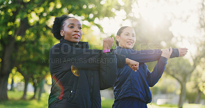 Buy stock photo Interracial women, fitness and stretching body for workout, exercise or training together in nature. Female person, friends or personal trainer in warm up stretch or coaching at park for wellness