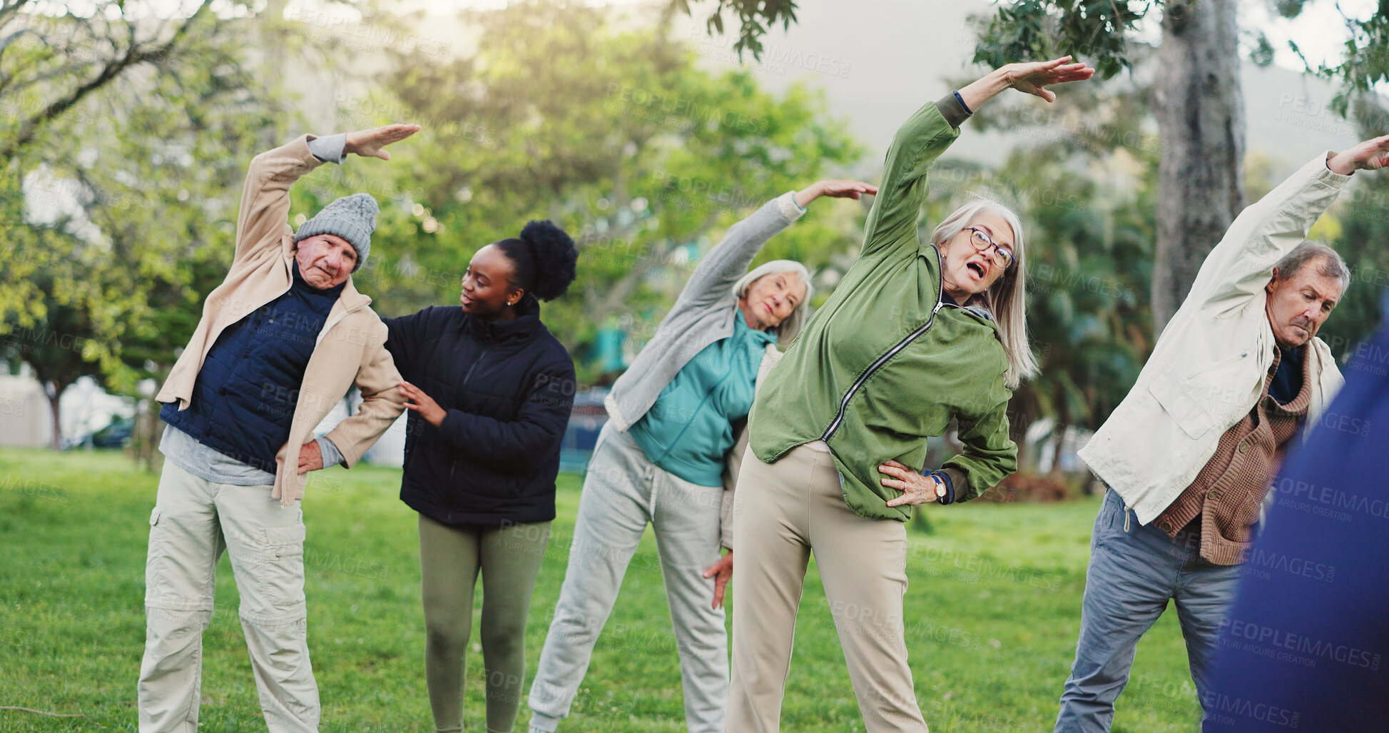 Buy stock photo Yoga class, park and elderly group with coach exercise together in nature for health and wellness training. Peace, balance and senior people or friends outdoor workout or stretching for body fitness