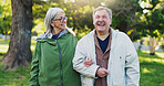 Senior couple, people and happy in park for bonding, support and care on retirement in London. Relationship, laugh or smile at outdoor with walk for fun, health and wellness as hobby for wellbeing
