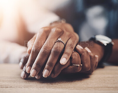 Buy stock photo Marriage, support and couple with holding hands on table for partnership, compassion and kindness. Care, trust and people with connection in love commitment for empathy, forgiveness and understanding