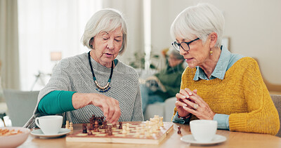 Buy stock photo Senior woman, friends and playing chess on table for social activity, decision or strategy game at home. Elderly women enjoying competitive board games for fun bonding together in retirement house