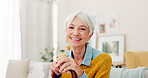 Happy, face and senior woman on sofa in nursing home or grandma with happiness or freedom in retirement to relax in house. Portrait, elderly person and smile in living room or thinking of good memory