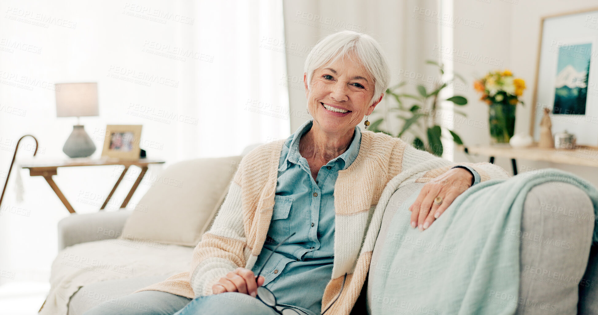 Buy stock photo Happy, senior woman and relax on sofa in nursing home or grandma with happiness, freedom and retirement in house. Portrait, elderly person and smile in living room or thinking of good memory