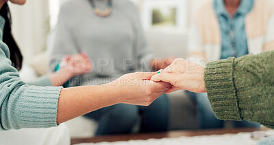 Woman, group and holding hands in support, elderly care or unity for trust, community or social gathering at home. Closeup of women touching hand in teamwork activity, understanding or collaboration