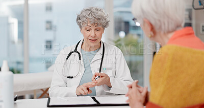 Senior woman, doctor and consulting patient with pamphlet for information, quotation or service at hospital. Mature medical professional talking and explaining healthcare advice or life insurance