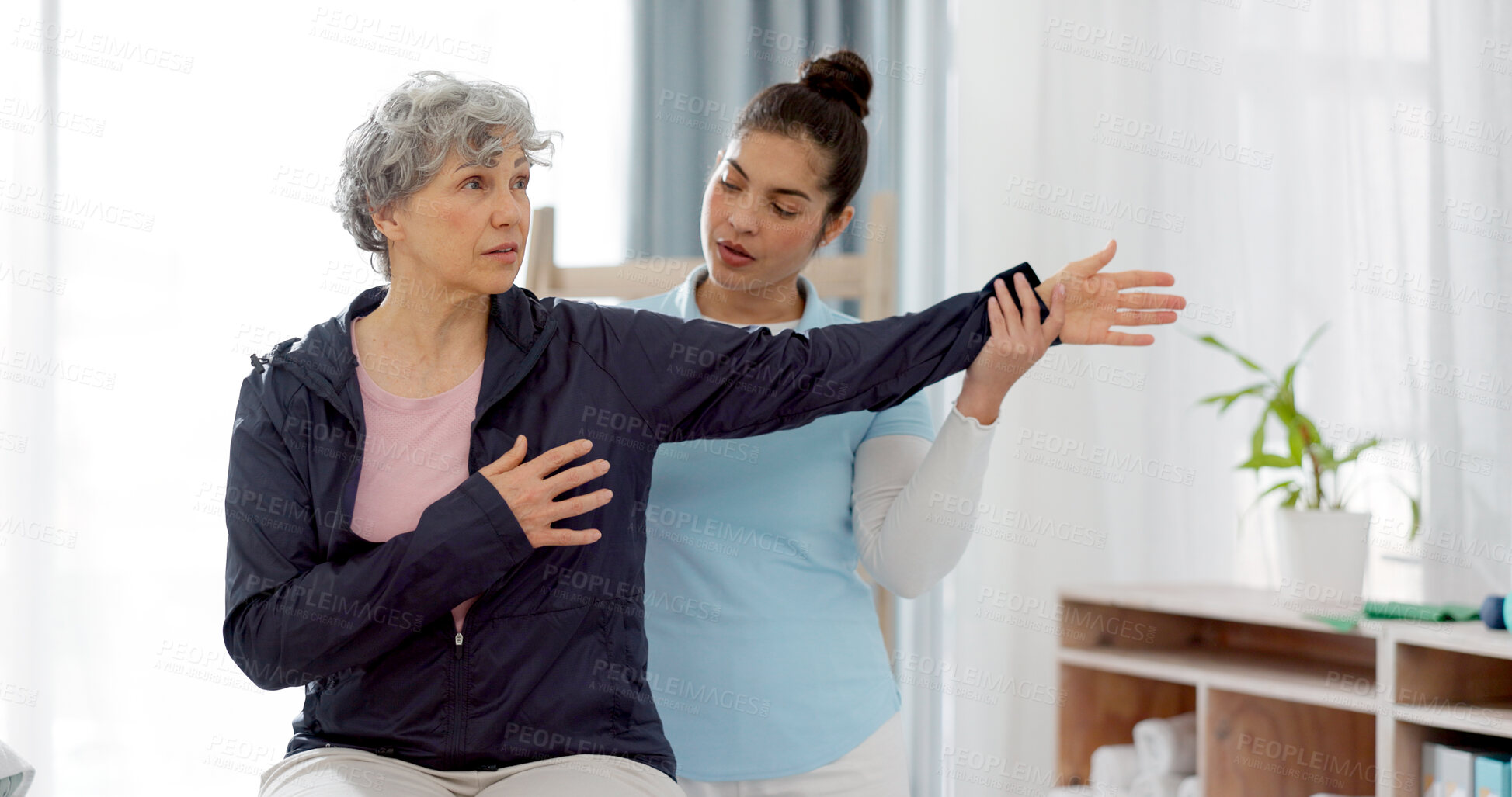 Buy stock photo Physiotherapy, arm and senior woman consulting physiotherapist for injury, healthcare and osteoporosis. Chiropractor, stretch or old person with pain, shoulder and rehabilitation with medical problem