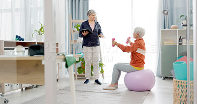 Buy stock photo Senior woman, exercise ball and personal trainer in home, tablet or app for training advice, workout or health. Elderly lady, dumbbells or fitness coach for chat, motivation or support in retirement