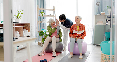 Senior woman, fitness and together with high five, personal trainer and exercise ball with workout achievement. Elderly lady, training and young coach with goals, motivation or support in retirement