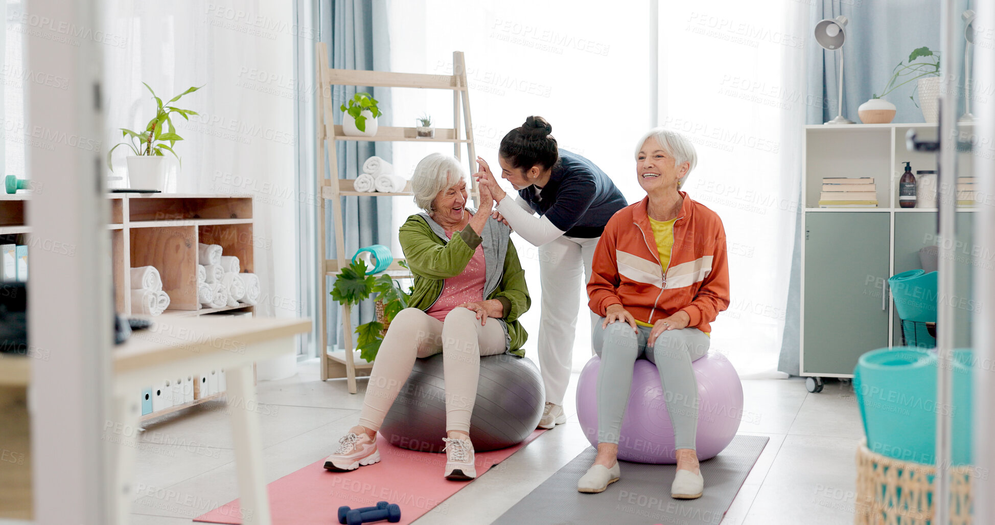 Buy stock photo Senior woman, fitness and together with high five, personal trainer and exercise ball with workout achievement. Elderly lady, training and young coach with goals, motivation or support in retirement