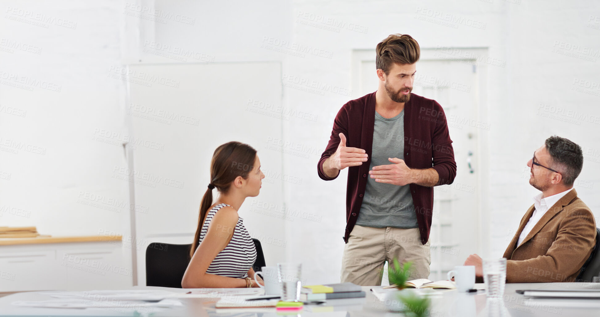 Buy stock photo Meeting, teamwork and business people in office for discussion on creative project together. Conversation, planning and group of professional designers working in collaboration in workplace boardroom