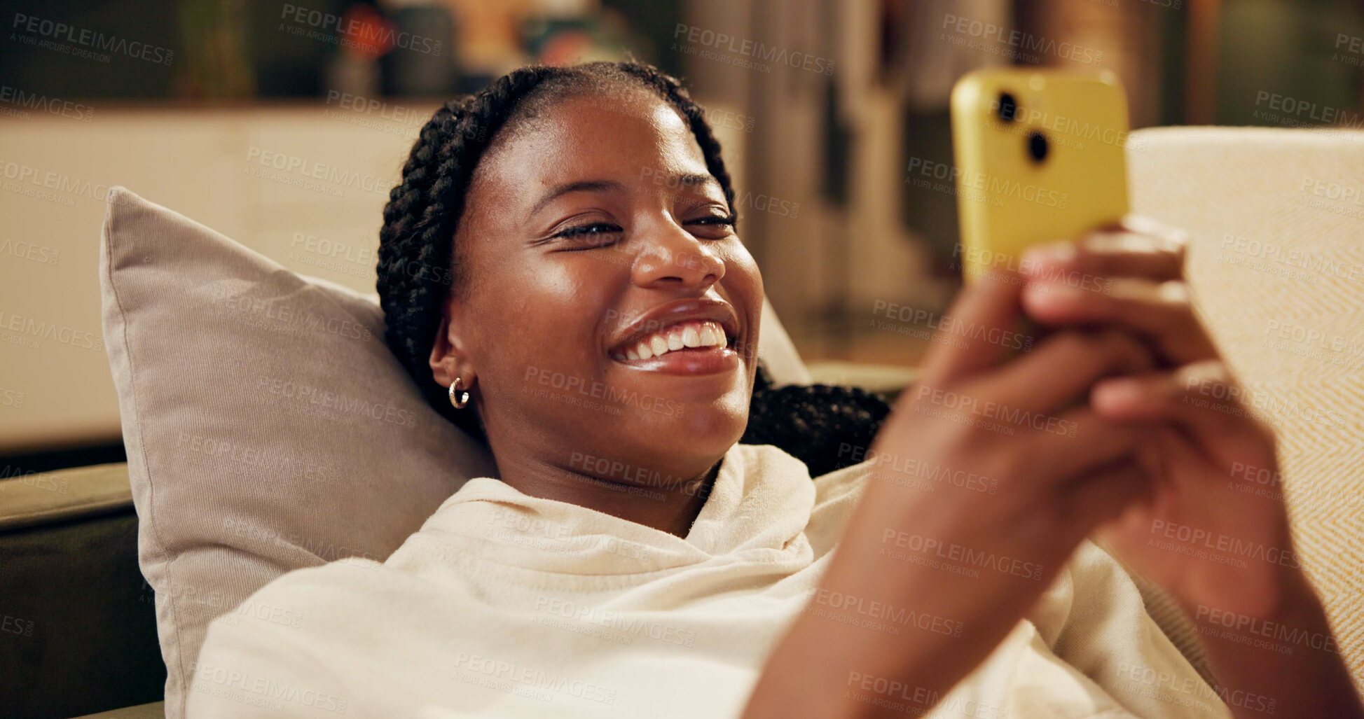 Buy stock photo Happy, typing and black woman with phone on sofa for online chat, communication and networking. Relax, home and person on smartphone for social media, funny website and internet news in living room