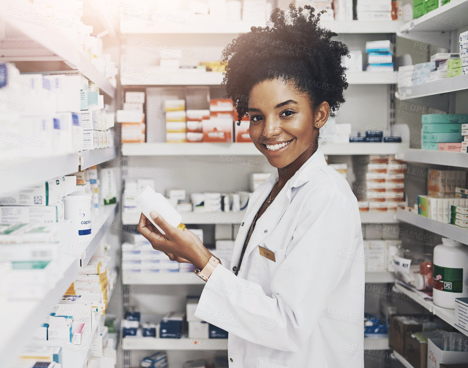 Buy stock photo Black woman, portrait and pharmacist with product in clinic of medicine stock, reading and check information on label. Smile, female person and pills box for medical inventory, inspection and retail
