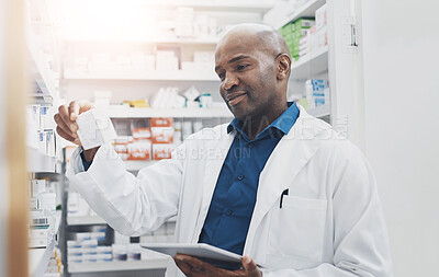 Buy stock photo Black man, tablet and pharmacist check medicine for stock, inventory or reading label on box at shelf. Tech, pharmacy and medical worker with drugs for online prescription, information or telehealth