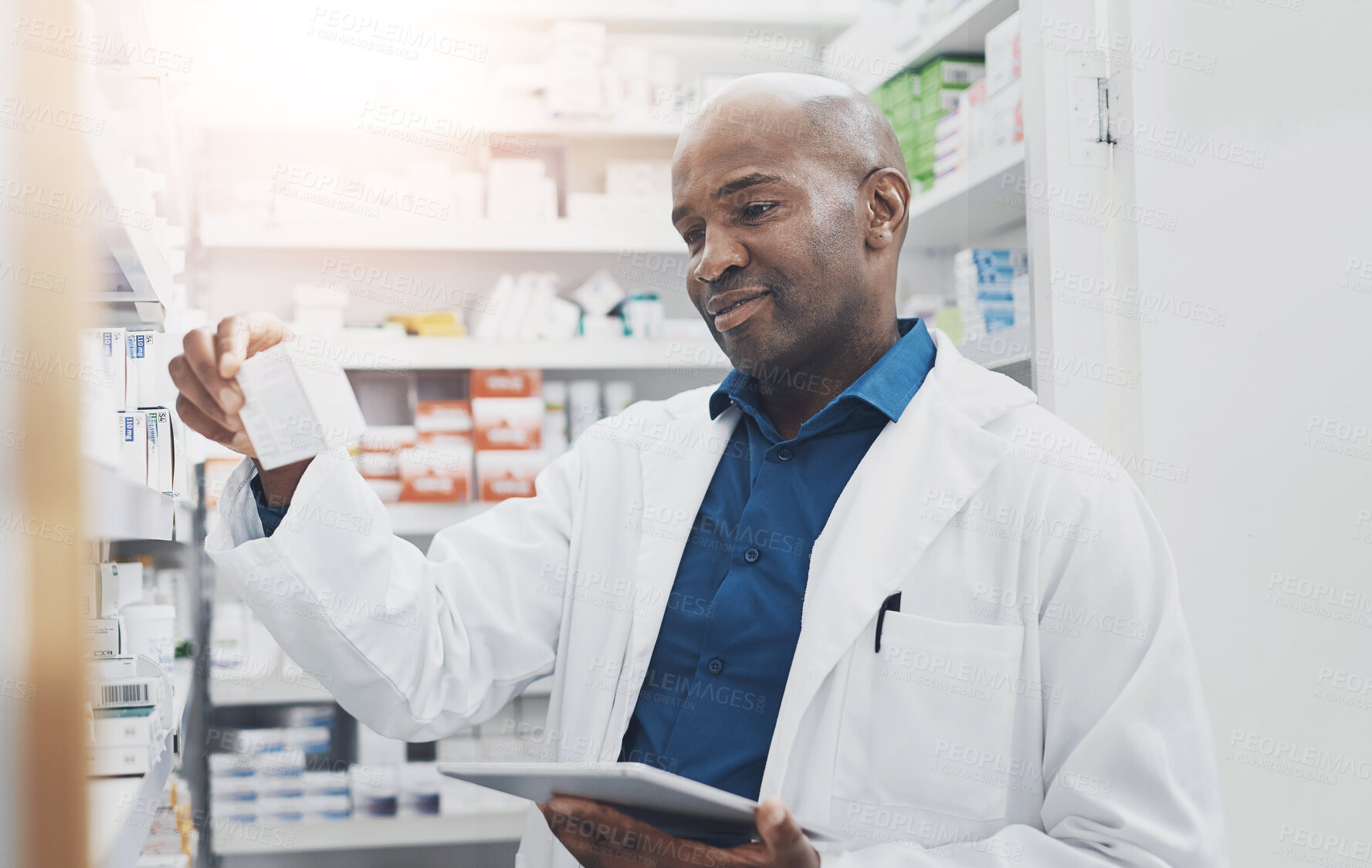 Buy stock photo Black man, tablet and pharmacist check medicine for stock, inventory or reading label on box at shelf. Tech, pharmacy and medical worker with drugs for online prescription, information or telehealth