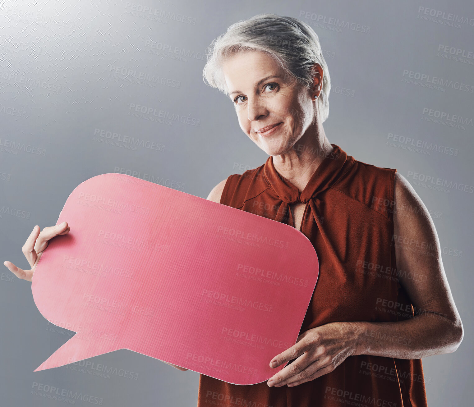 Buy stock photo Speech bubble, poster and portrait of woman in studio for news, forum and company feedback. Mockup, business and mature person with banner for info, promotion and social media on gray background