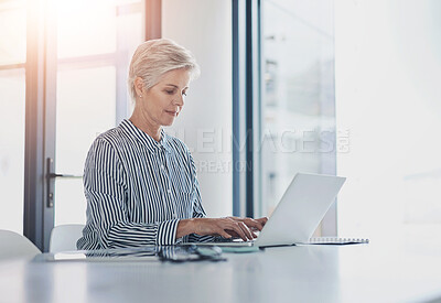 Buy stock photo Woman, research and desk with laptop in office for investment, update or reading finance news. Mature financial advisor, work and thinking with tech for foreign exchange, feedback or report to client