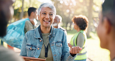 Buy stock photo Park, woman and volunteers discussion with tablet for support, community project or nature sustainability. Humanitarian, recycling or senior leader in charity service and NGO for pollution cleanup