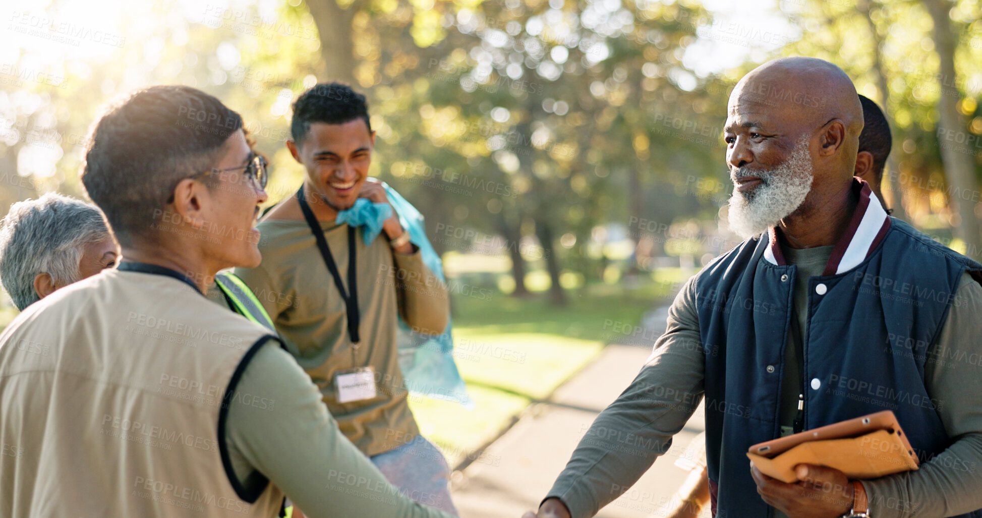 Buy stock photo Park, people and volunteers handshake with tablet for support, community project or nature sustainability. Humanitarian, recycling or senior leader in charity service or NGO for pollution cleanup