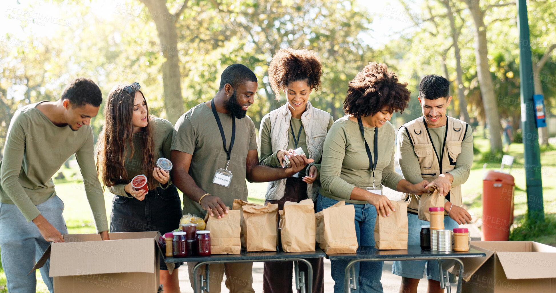 Buy stock photo People, volunteering and helping package in outside, kindness ngo and charity project with community in park. Distribution, food parcel and grocery boxes for donation, teamwork and collaboration