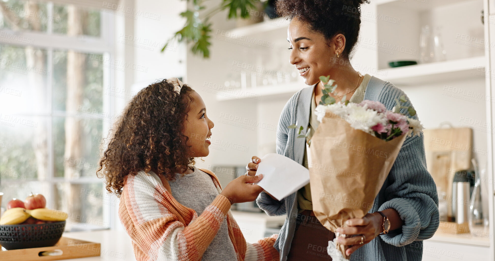 Buy stock photo Kitchen, mother and girl with card, flowers and present for birthday, love and family in house. Home, mom and together with daughter, happiness and cute in apartment, woman and child with smile