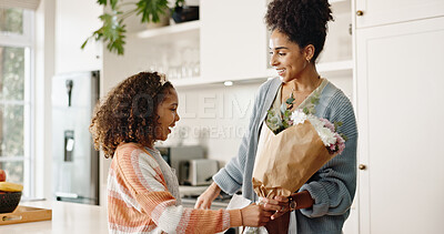 Buy stock photo Kitchen, mother and girl with gift, flowers and present for birthday, love and family in house. Home, mom and daughter with embrace, happiness and cute in apartment, woman and child with smile