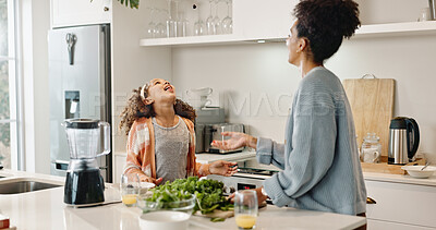 Mother, daughter and kitchen with breakfast for morning, eating or healthy nutrition together at home. Happy mom, child and little girl with funny face for vegetables, vitamin C or juice at house