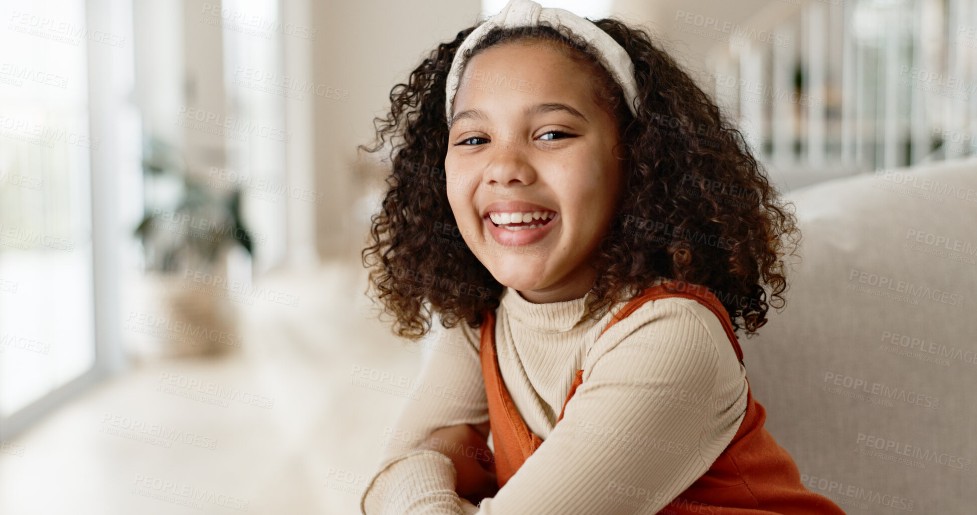 Buy stock photo Girl child, portrait and happy on sofa for relax on weekend break, rest and growth or development with positivity. Kid, face and joy or comfort on couch in living room for free time in home or house.