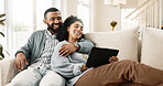 Couple, love and internet on sofa with tablet on streaming application for home entertainment, subscription and movies. Man, woman and together in house with technology on couch for online videos.