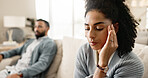 Frustrated couple, headache and sofa with disagreement for fight, divorce or breakup at home. Upset woman and man in living room with dispute, conflict or argument for toxic relationshop at house